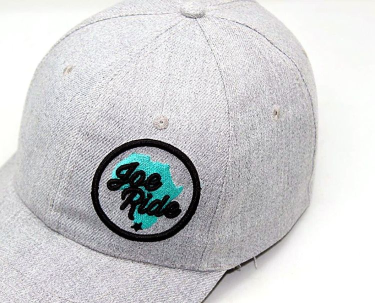 Grey cap with circular Joe Ride badge embroidery Joe Ride badge cap